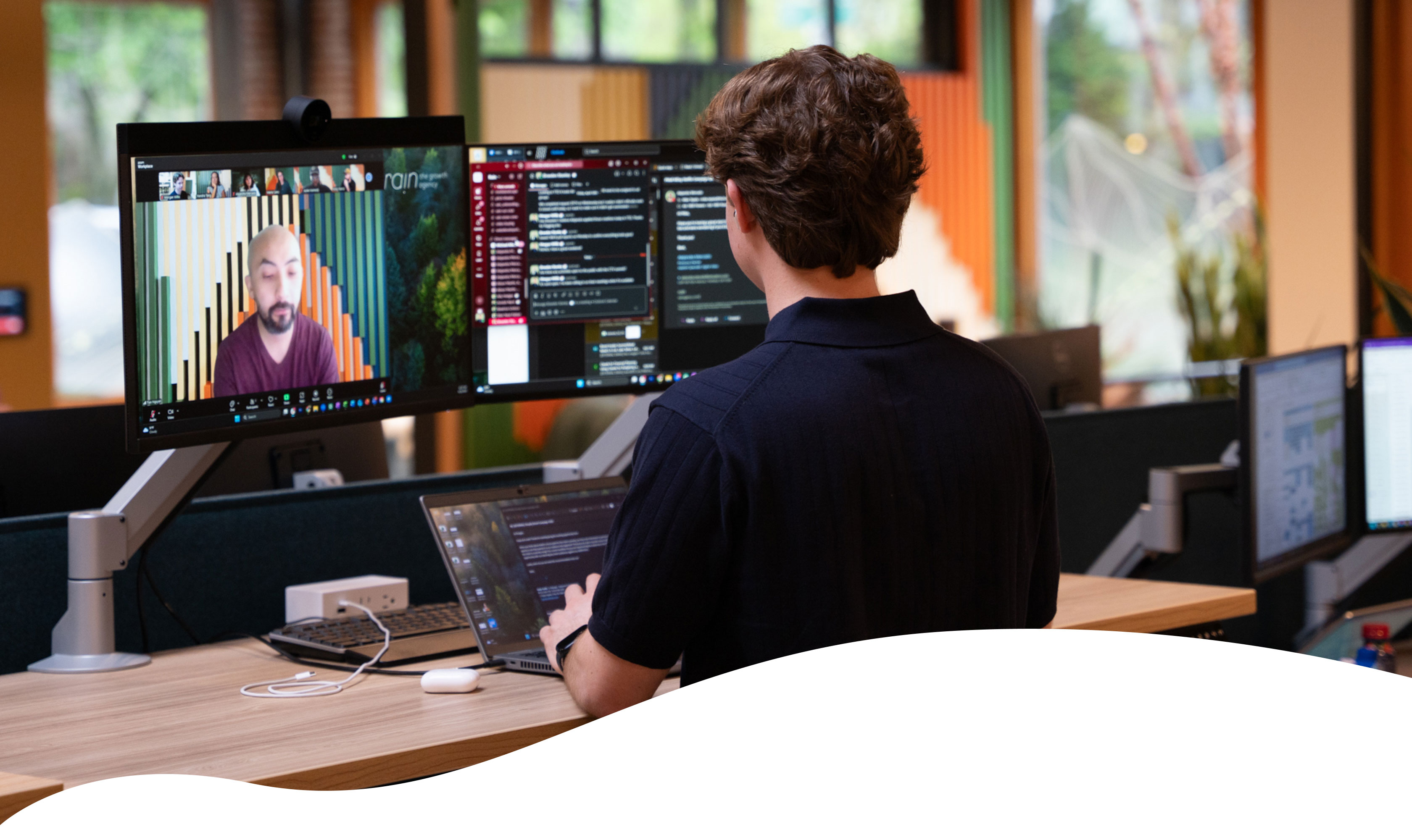 person standing at a desk on a Zoom call